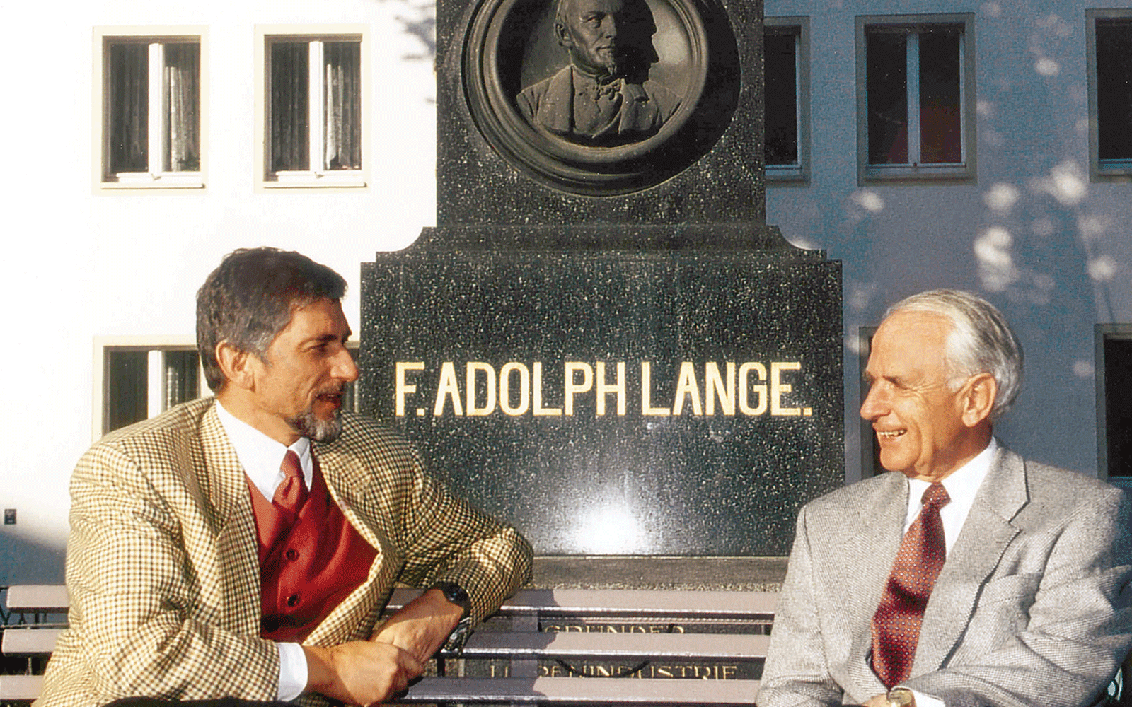 Günter Blümlein and Walter Lange in front of Ferdinand Adolph Lange’s monument in Glashütte’s centre