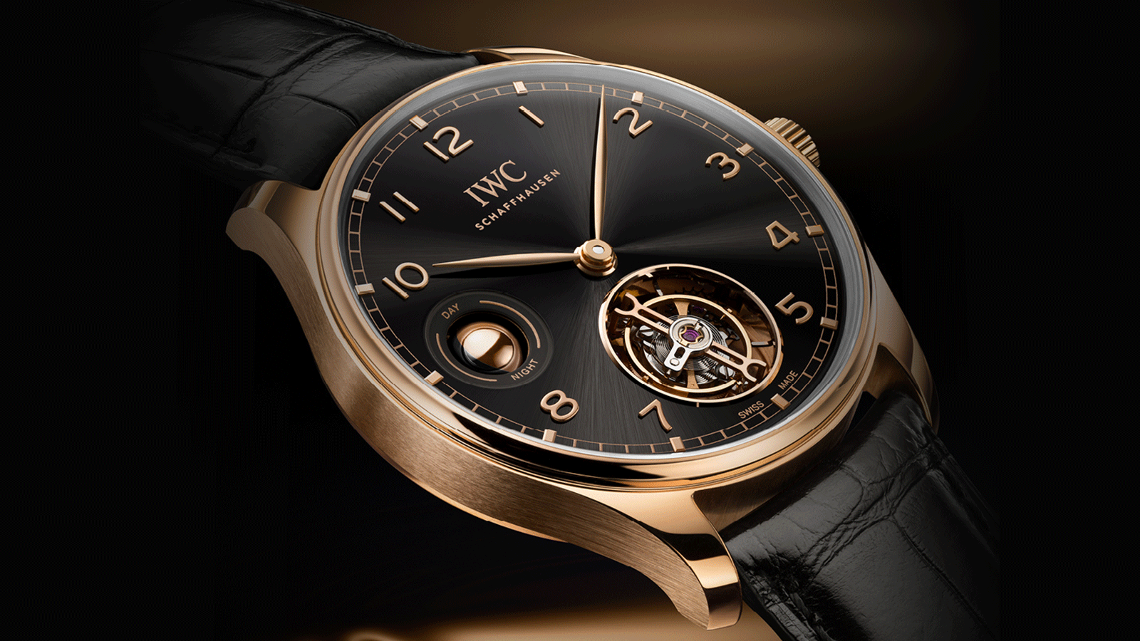 IWC Schaffhausen introduces the Portugieser Hand-Wound Tourbillon Day & Night at Watches and Wonders Geneva. It combines an 18-carat Armor Gold® case with an Obsidian lacquered dial and gold-plated hands and gold appliques.