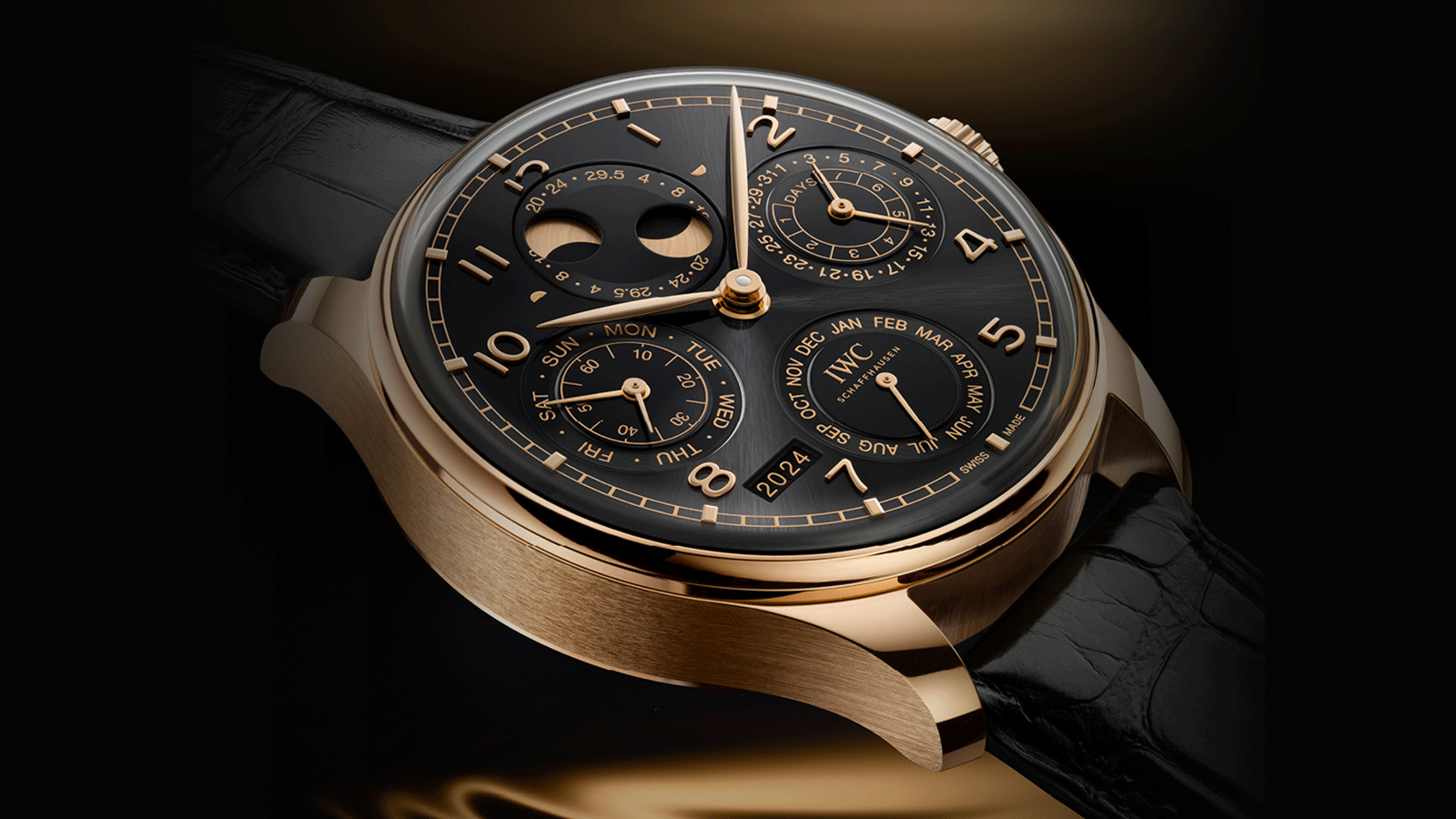 IWC Schaffhausen introduces the Portugieser Hand-Wound Tourbillon Day & Night at Watches and Wonders Geneva. It combines an 18-carat Armor Gold® case with an Obsidian lacquered dial and gold-plated hands and gold appliques. 