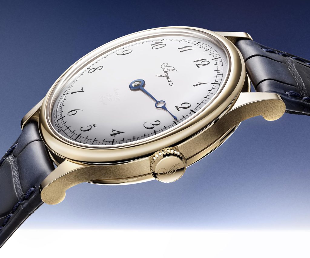 Side profile of Breguet Classique Souscription 2025 showing the warm-toned Breguet gold case with satin-brushed finish, curved lugs, and chevé sapphire crystal.