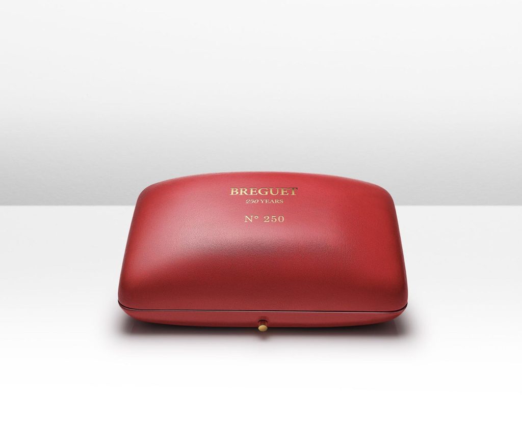 Red leather presentation box for Breguet Classique Souscription 2025 with gold embossing showing "BREGUET 250 YEARS" and individual watch serial number.