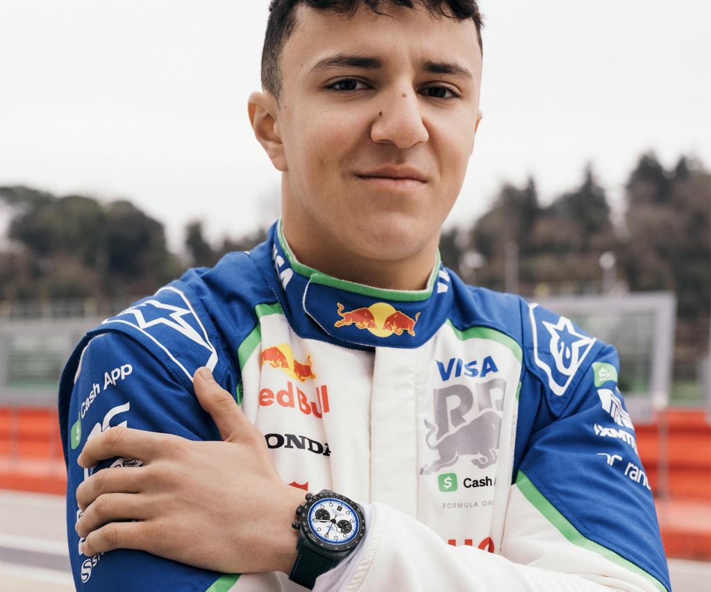 Racing driver in team uniform wearing the TUDOR Black Bay Chrono Carbon 25