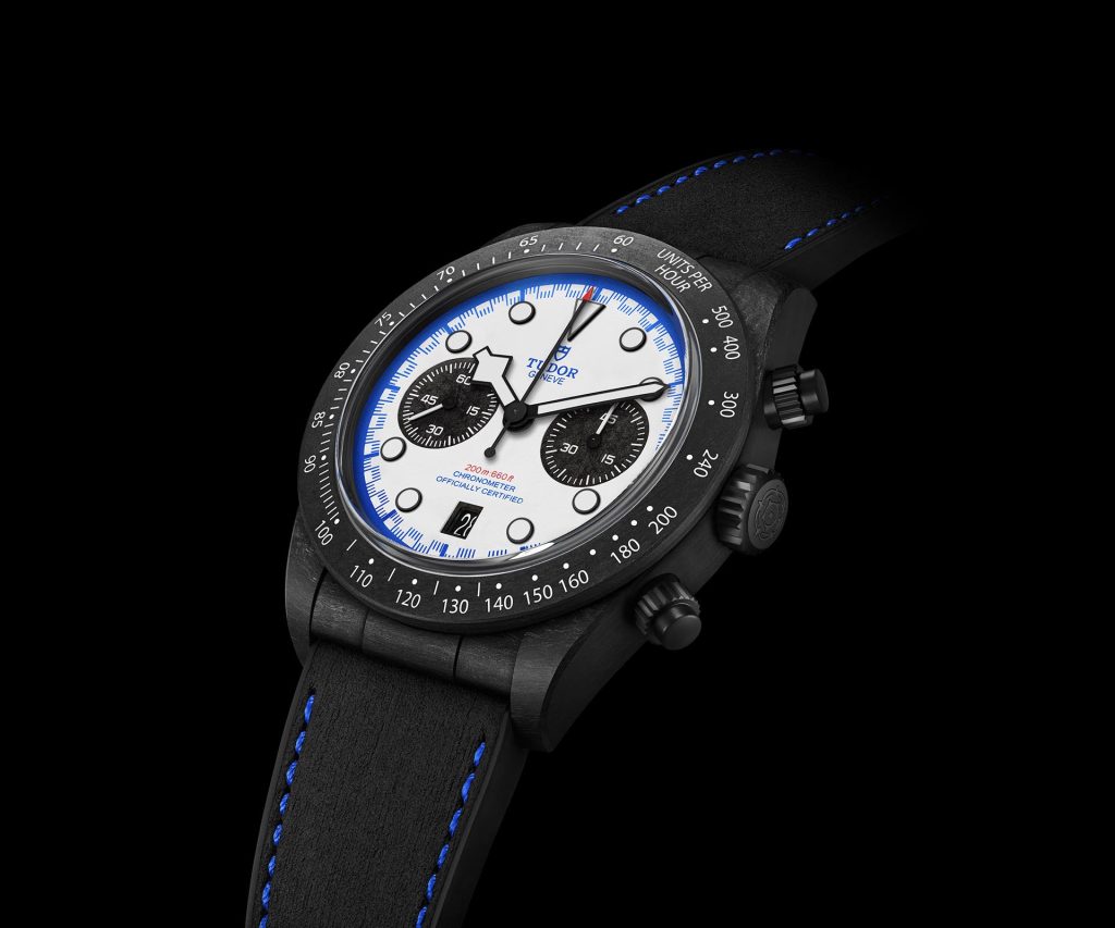 Close-up detail of TUDOR Black Bay Chrono Carbon 25 M79377KN-0001 showing carbon fibre case and white dial with black sub-counters