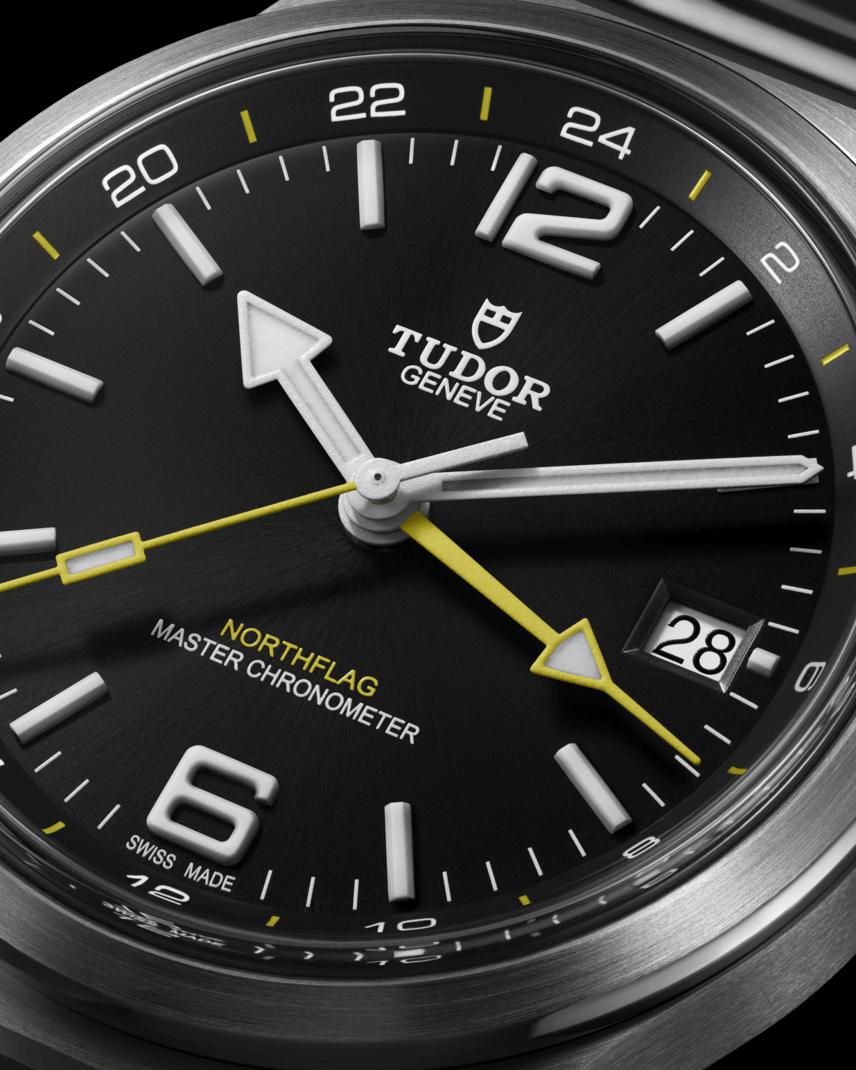 Close-up of the TUDOR Northflag black dial with Arabic hour markers, 24-hour rehaut and date at 3 o'clock